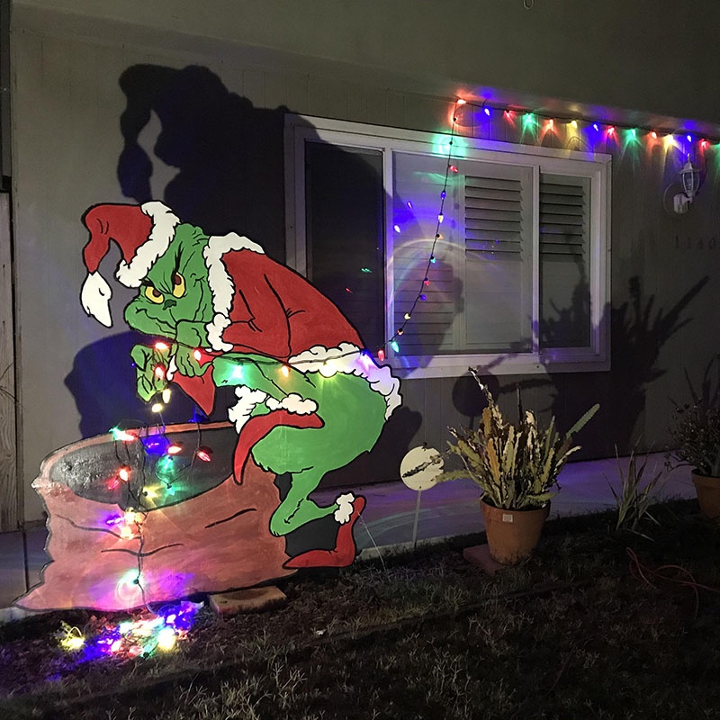 This Grinch Stealing Christmas Lights Decor is So Clever, It's Sneaky!